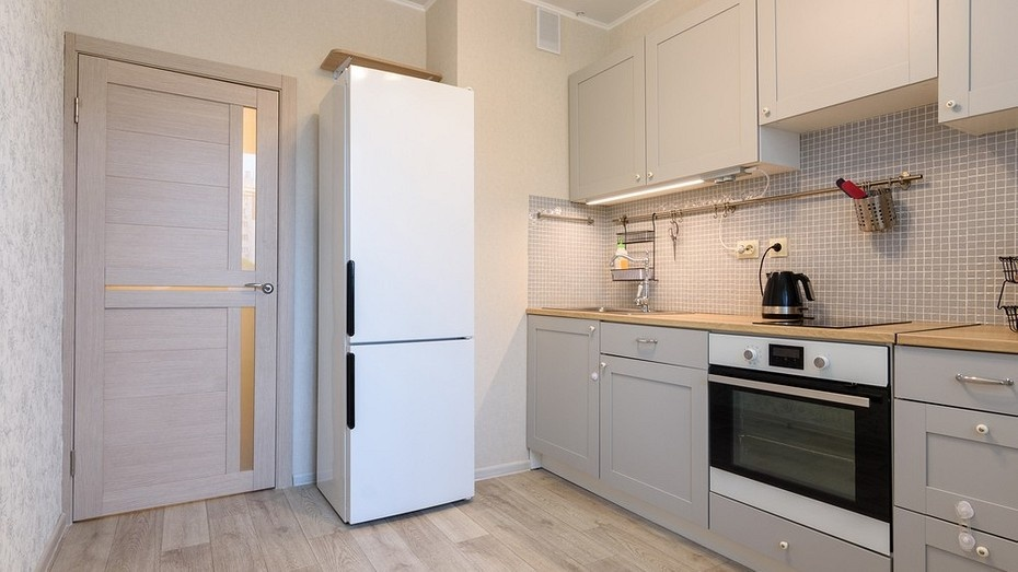 white refrigerator in a gray kitchen
